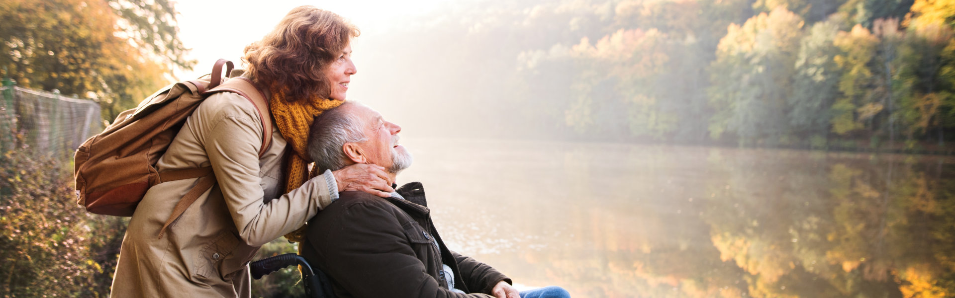 a woman and elderly man smiling